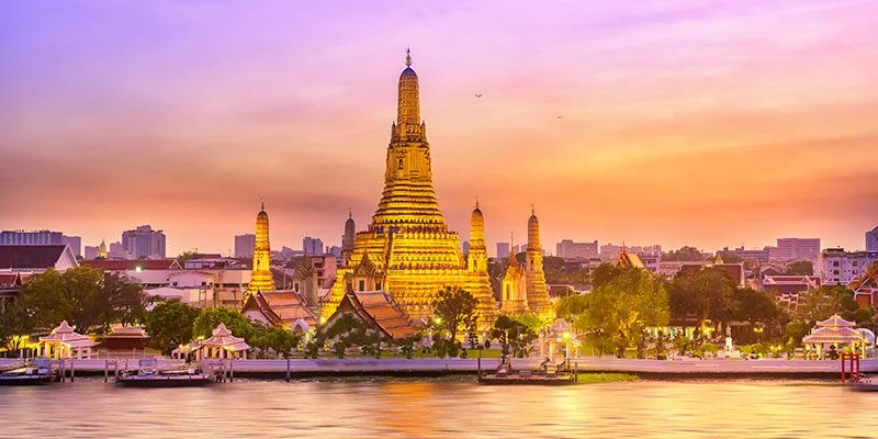 Wat Arun and Bangkok's river at sunset
